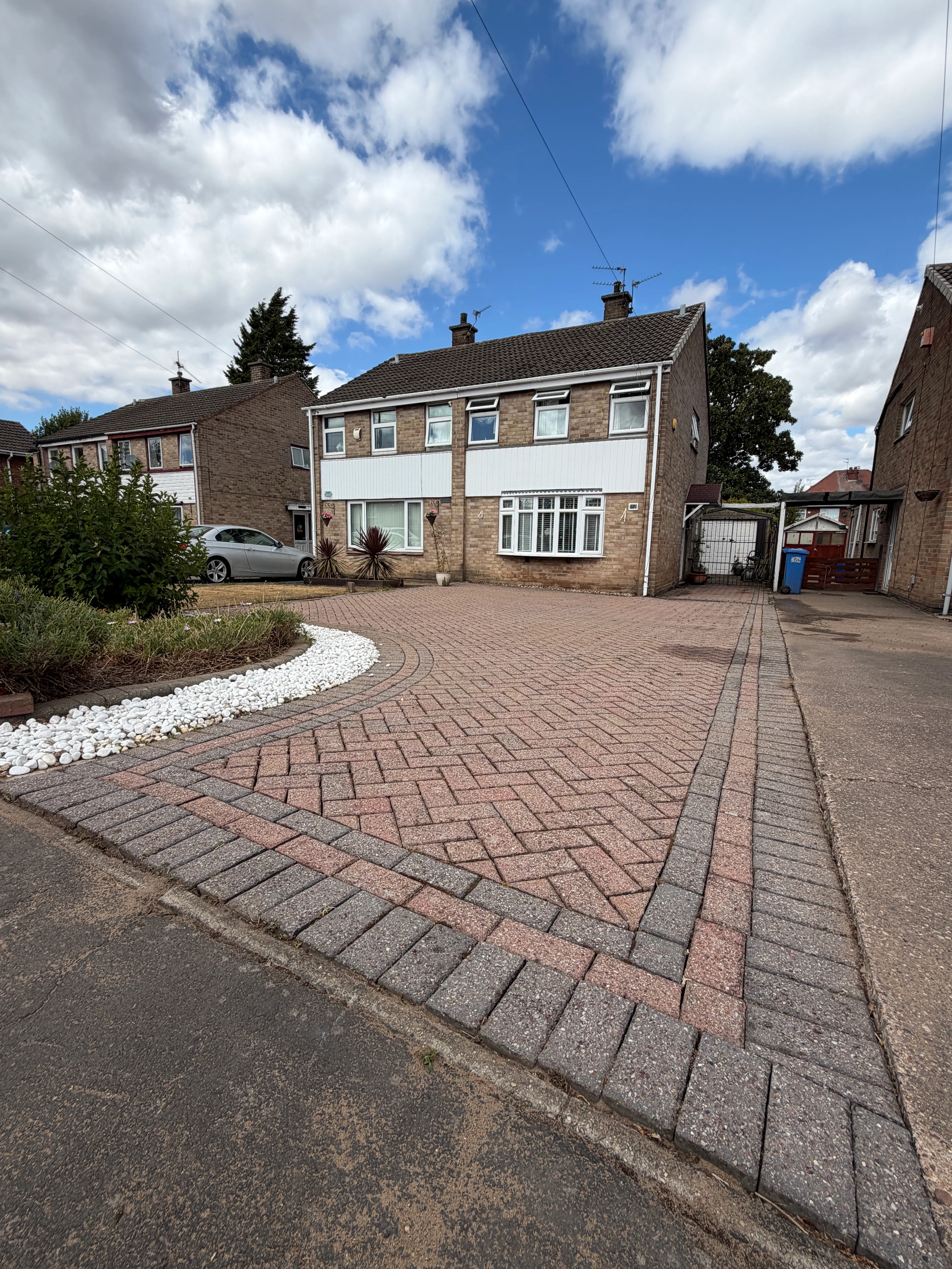 Garden in Derby after a tidy-up: borders cleared, lawn neat and hedges trimmed